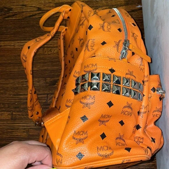 Orange silver studded mcm backpack
